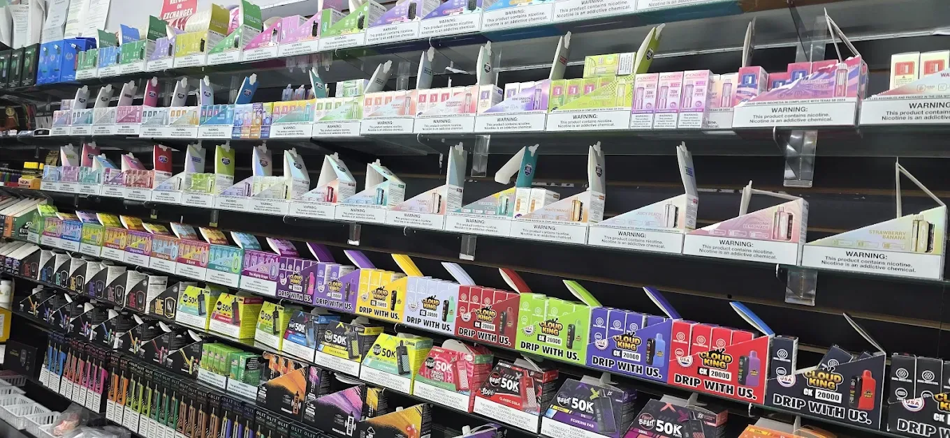 Product shelf with vape and smoking products at Smokey Houston